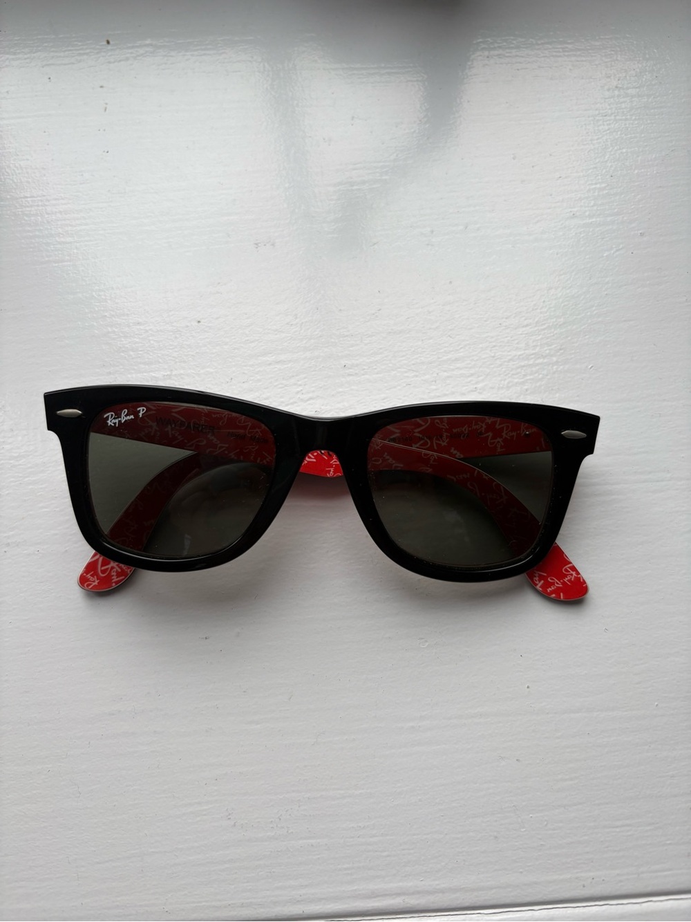 Ray-Ban Black Frame Sunglasses with Red Temples